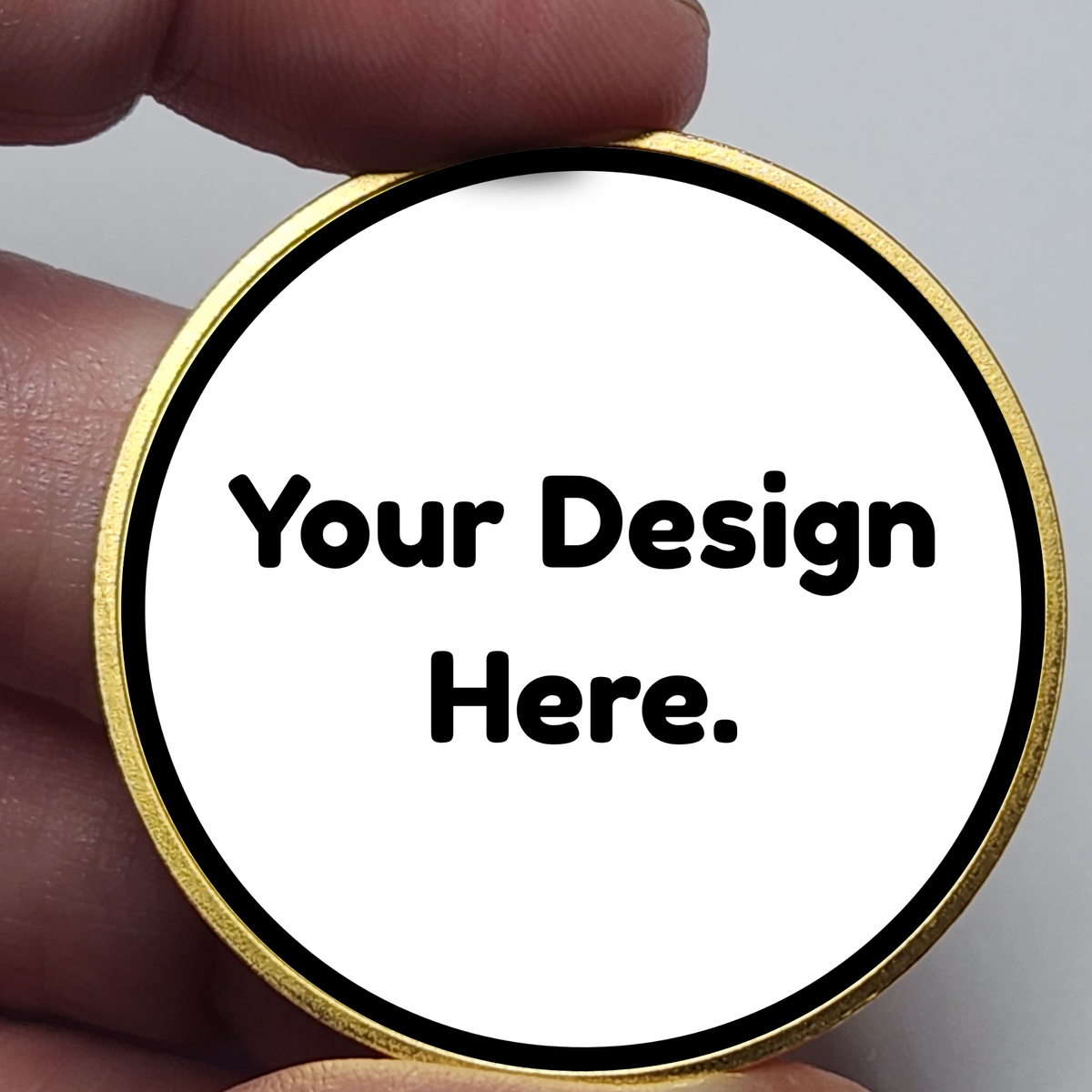 Round gold custom coin with placeholder text "Your Design Here."