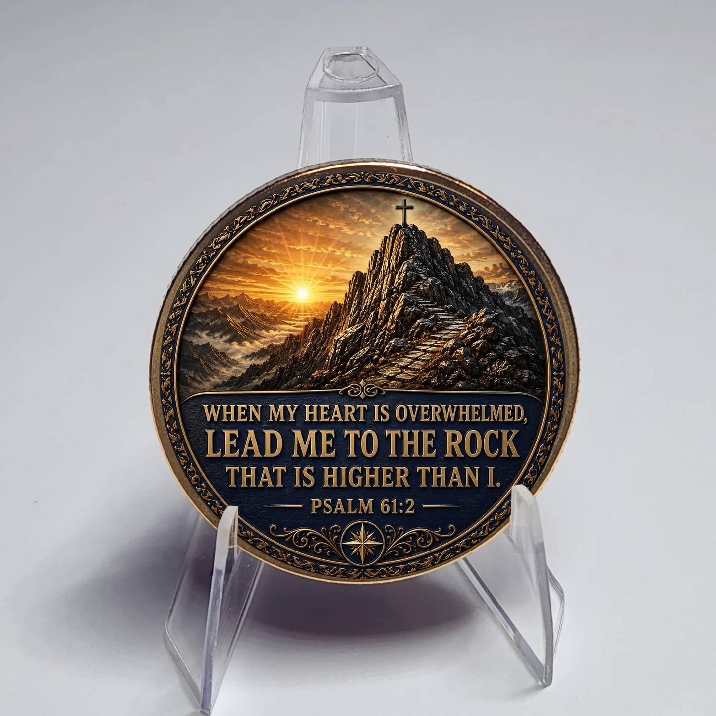 Close-up of gold-toned medallion coin displayed on clear acrylic stand