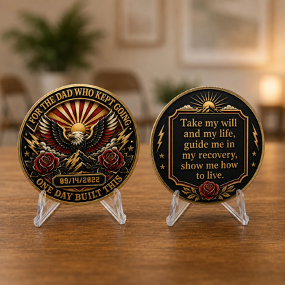 Recovery medallion coins on clear stands: eagle front and recovery quote back