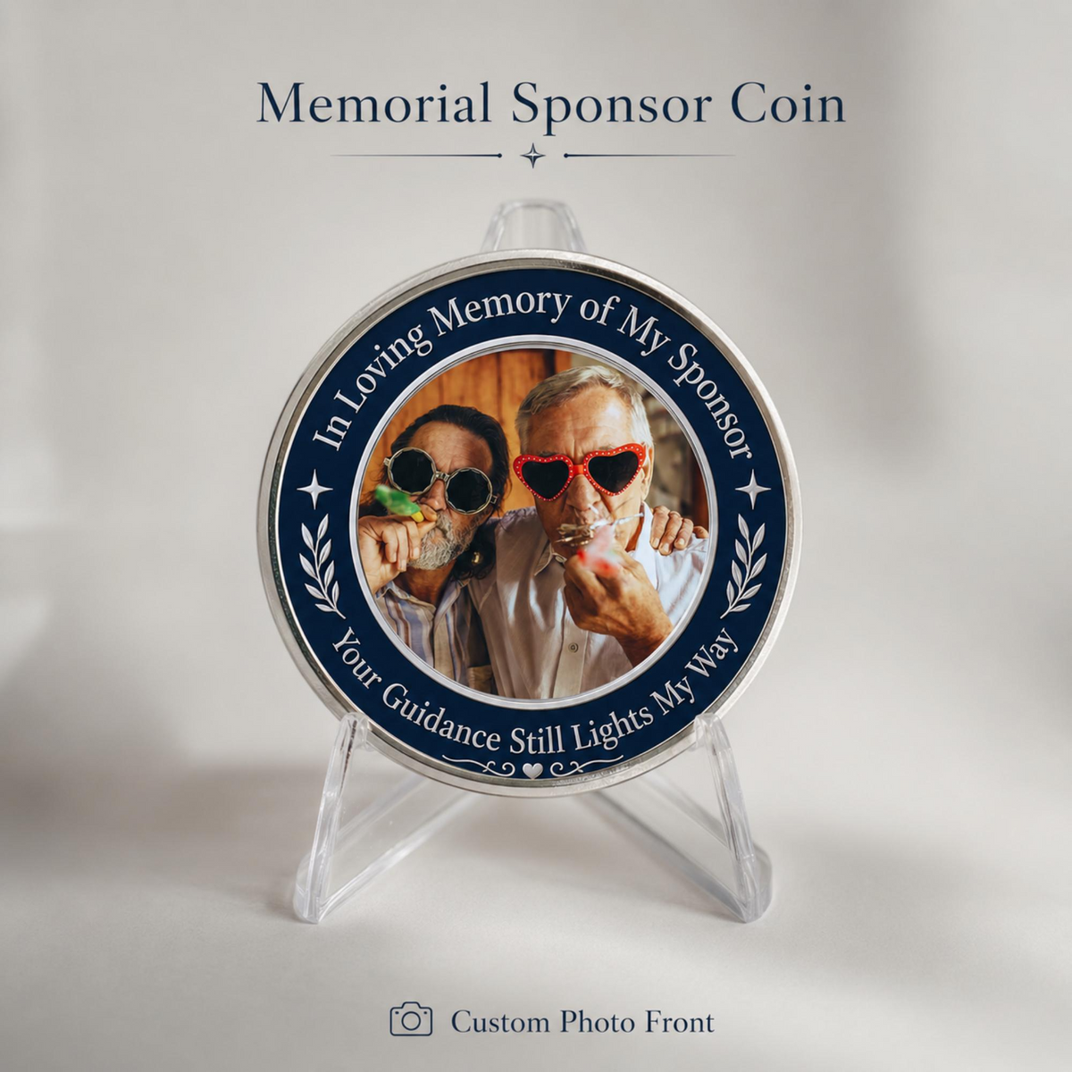 Round memorial sponsor coin with two men’s photo wearing sunglasses, on clear stand