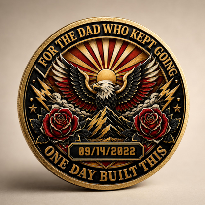 Close-up gold recovery coin medallion with eagle, red roses, and date 09/14/2022