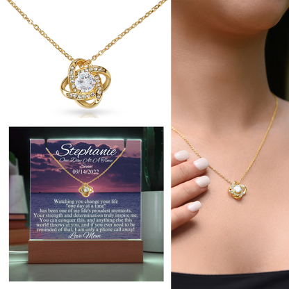 Gold-tone heart pendant necklace with small bezel-set cubic zirconia, shown on neckline