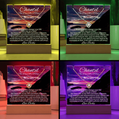 LED sobriety gift with glowing box and gold necklace pendant in purple, green, and red glow