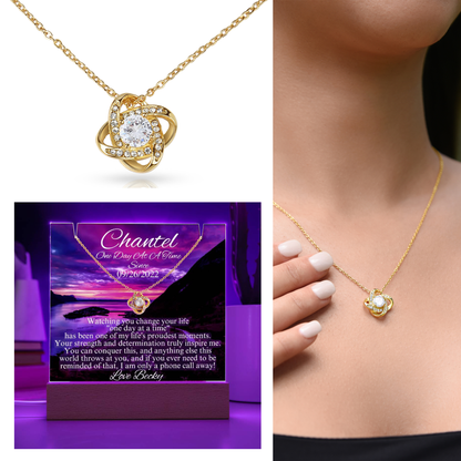 Gold-tone heart pendant necklace with adjustable chain, styled with LED sobriety gift box