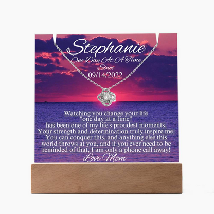 LED sobriety gift set card with silver-tone heart pendant necklace on wooden base