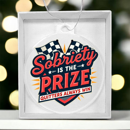 Round slogan ornament in gift box; white design with bold Sobriety Is The Prize text