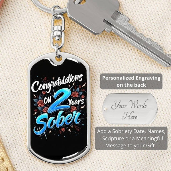 Silver dog tag keychain with front “Congratulations on 2 Years Sober” and engraved back panel.