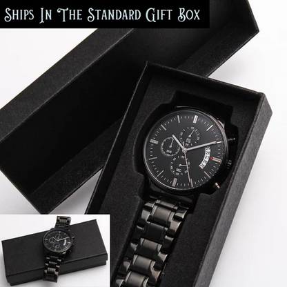 Black chronograph watch in open black presentation box with metal bracelet