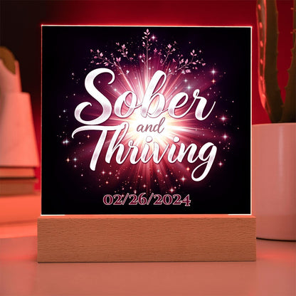 LED acrylic plaque: 'Sober and Thriving' with date on wood base, red glowing border