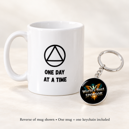 Reverse of the white mug shows a triangle symbol and “One Day at a Time,” with Phoenix keychain.
