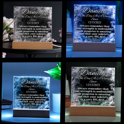 Multi-color glowing LED acrylic name plaque on wood base, Danielle text