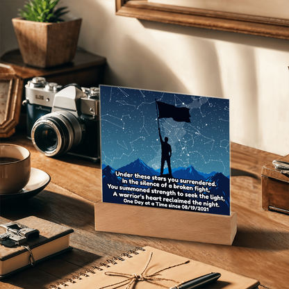 LED star map on wooden base with blue constellation lines, standing figure holding flag
