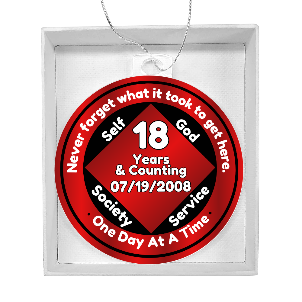 Acrylic recovery milestone ornament with red “18 Years” design and silver hanging chain.