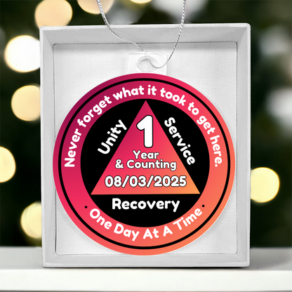 Acrylic recovery milestone ornament with red “1 Year & Counting” badge and silver chain.