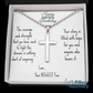 Silver cross pendant necklace with engraved message card in gift box, close-up