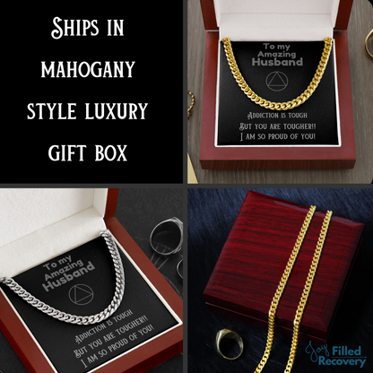 Gold Cuban link chain necklace in gift box with black card and pendant text