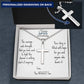 Silver cross necklace with ball-chain, shown in a gift box with engraved note