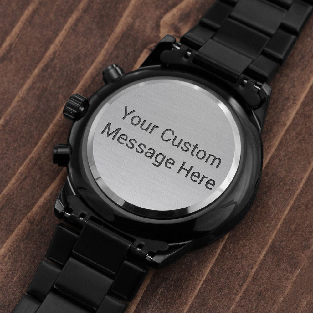 Black engraved wristwatch with round caseback reading 'Your Custom Message Here'