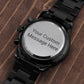 Black engraved wristwatch with round caseback reading 'Your Custom Message Here'