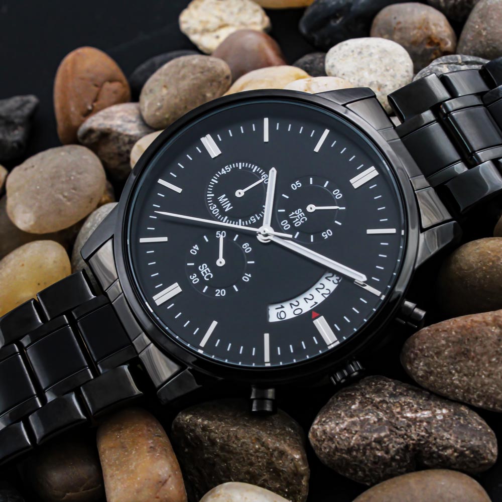 Black chronograph wristwatch with date window and three subdials, black metal band