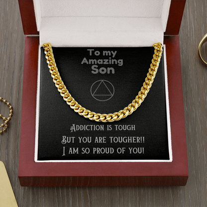 Gold-tone cuban link chain necklace on message card in red presentation box