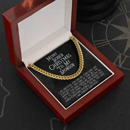 Gold-tone Cuban link chain necklace with message card reading “Merry Sober Christmas to My Sponsor”.