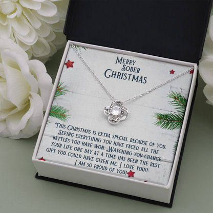 Necklace in open gift box with round heart pendant and silver chain