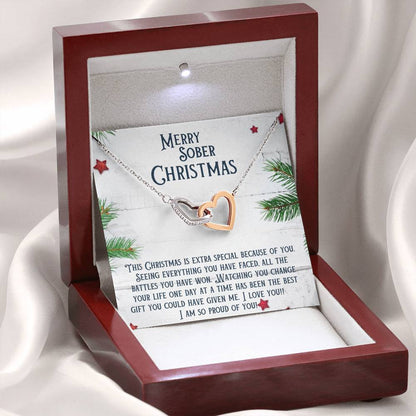 Two-tone heart necklace pendant with silver chain displayed in a gift box